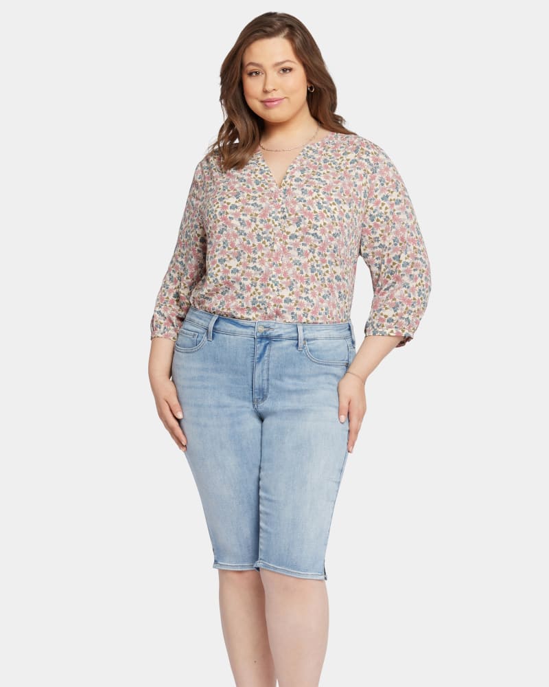 Front of a model wearing a size 26W Sheila Bike Capri in AFTERGLOW by NYDJ. | dia_product_style_image_id:295282